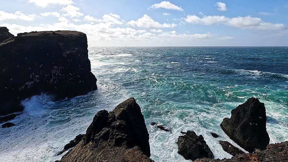 ValahnAokur dramatic basalt cliff corner with seabirds and open Atlantic Ocean, Reykjanes Peninsula, Iceland