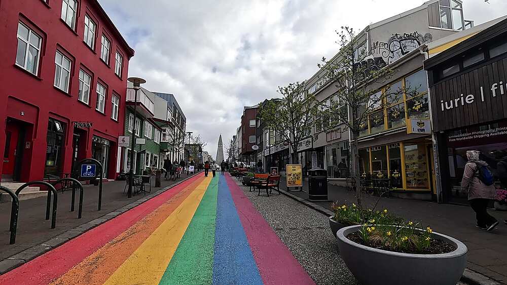 SkA3lavA?rA?ustA?gur rainbow painted street leading to HallgrA?mskirkja church, Reykjavik city centre, Iceland