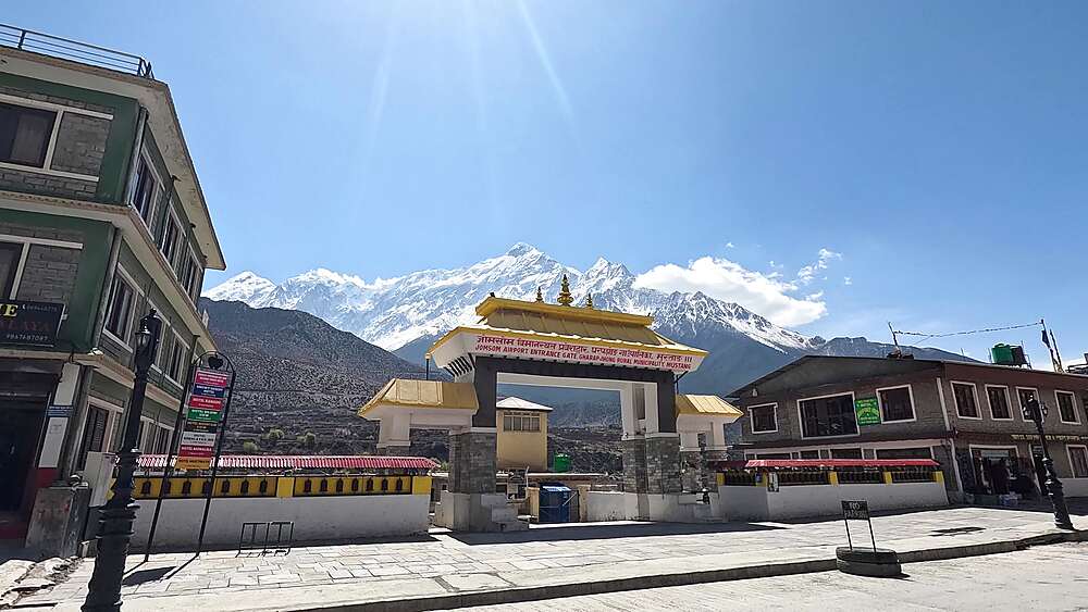 Jomsom airport entrance gate Nilgiri snow peaks street Mustang Nepal Himalaya landmark