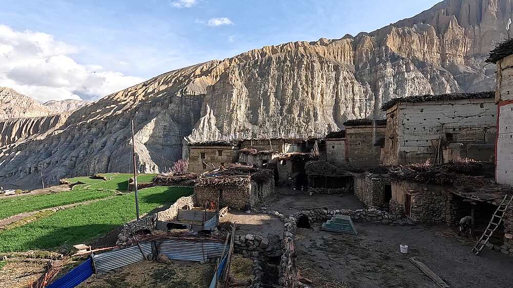 Elevated shot over Tetang village fields and stone houses, Tetang, Nepal