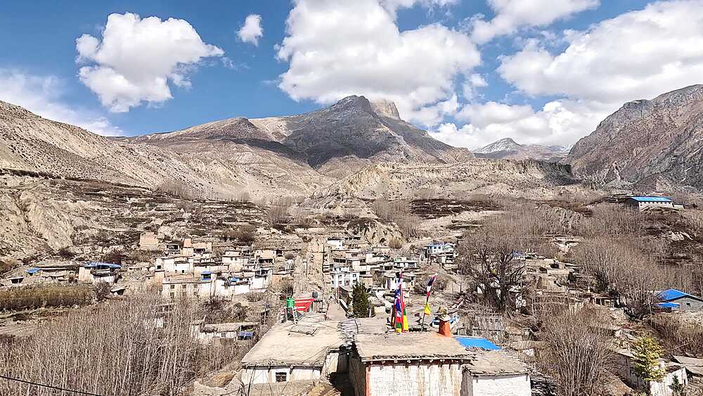 Wide shot from Jhong monastery over village rooftops and valley, Jhong, Nepal