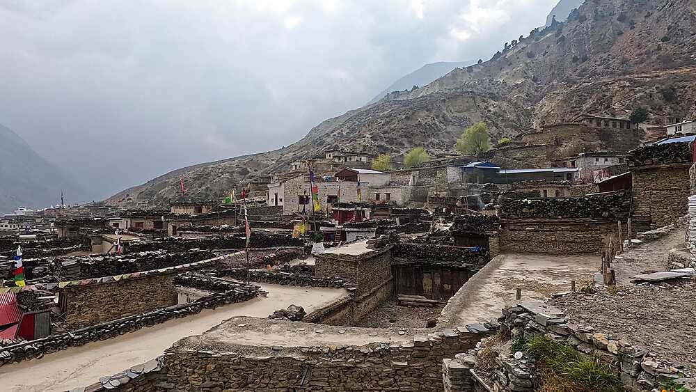 Wide pan view over the traditional stone settlement walls of Marpha Villagen, Mustang, Nepal.