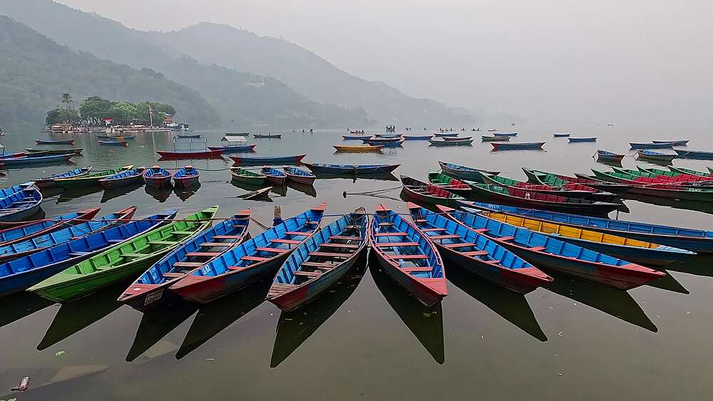 Artistic overhead boats with shadow reflections on calm Phewa Lake water symmetric<br />1372-3738 Artistic overhead boats with shadow reflections on calm Phewa Lake water symmetric