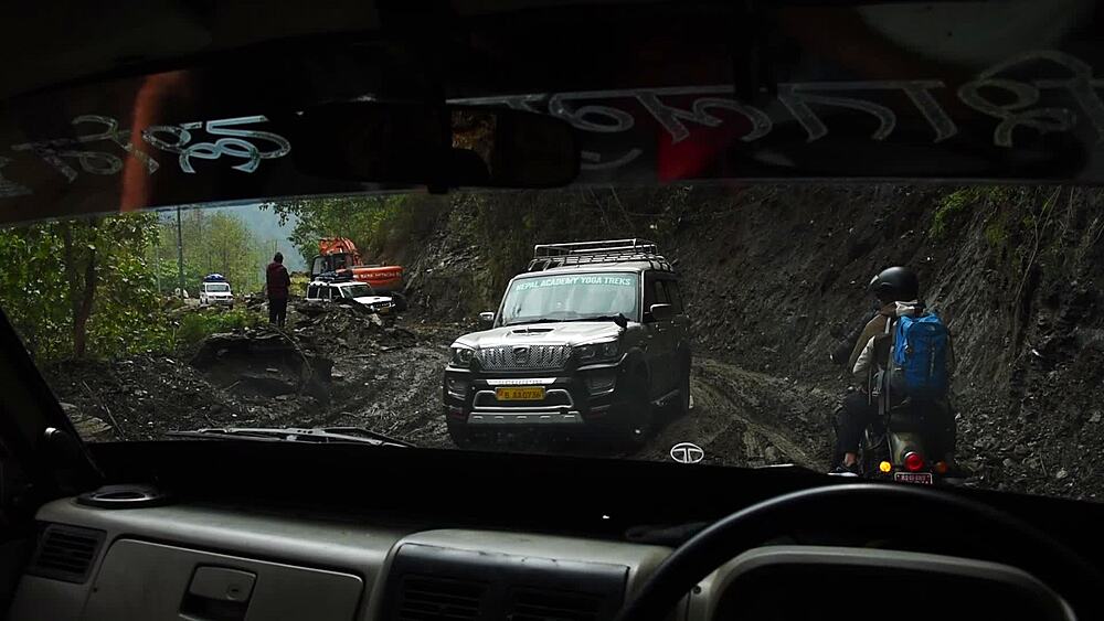 Travelling shot from a jeep on a rough muddy mountain road, Annapurna region, Nepal