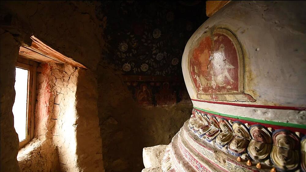 Natural light falling on the painted chorten inside the Luri Gompa cave monastery, Yara, Upper Mustang, Nepal