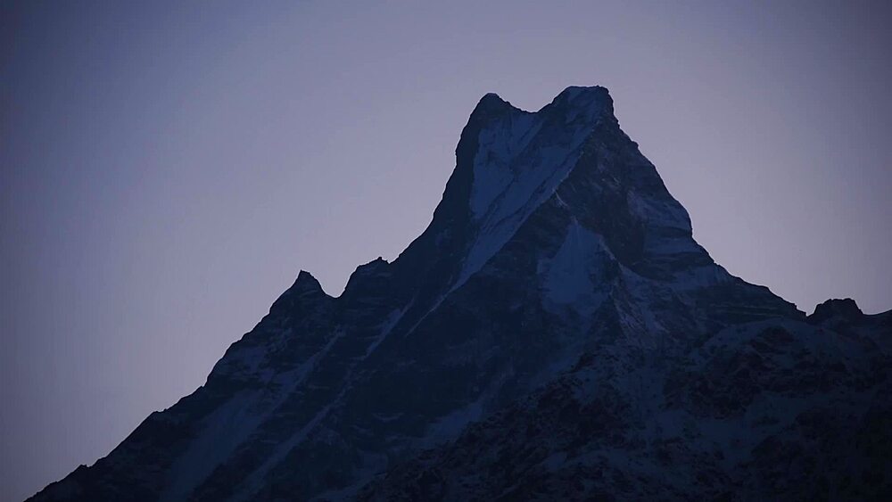Close view of the sharp twin summit of Machapuchare (Fishtail) at dusk, Annapurna region, Nepal