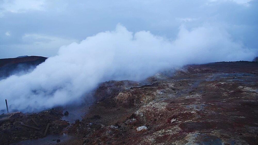 Static shot of steam rolling across geothermal field at Gunnuhver at dusk, Reykjanes Peninsula, Iceland