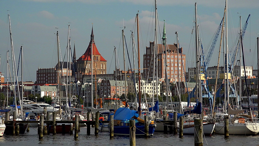 Warnowufer Street on Warnow River with St. Mary's Church, Rostock, Mecklenburg-Western Pomerania, Germany