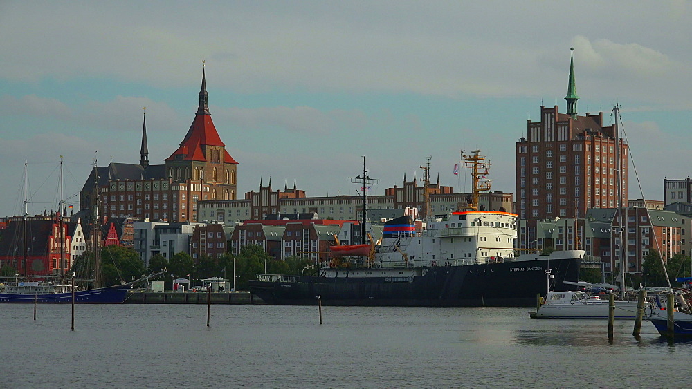 Warnowufer Street on Warnow River with St. Mary's Church, Rostock, Mecklenburg-Western Pomerania, Germany