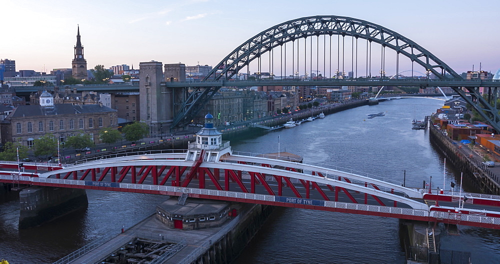 Time Lapse of View of The Tyne Bridge, Swing Bridge and Tyne River at dusk, Newcastle-upon-Tyne, Tyne and Wear, England, United Kingdom, Europe