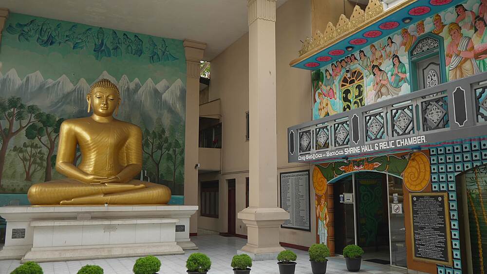 View of golden Buddha in Fort Sambuddhaloka Buddhist temple , Fort, Colombo, Sri Lanka, Asia