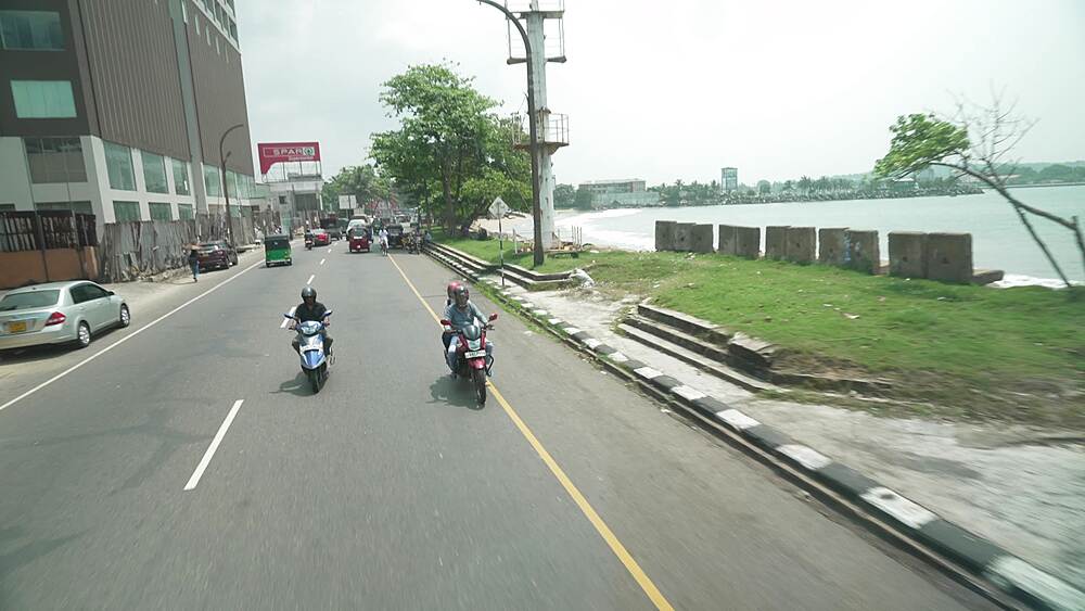 Elevated view tuk tuks and other traffic in road in Galle, Southern Province, Sri Lanka, Asia