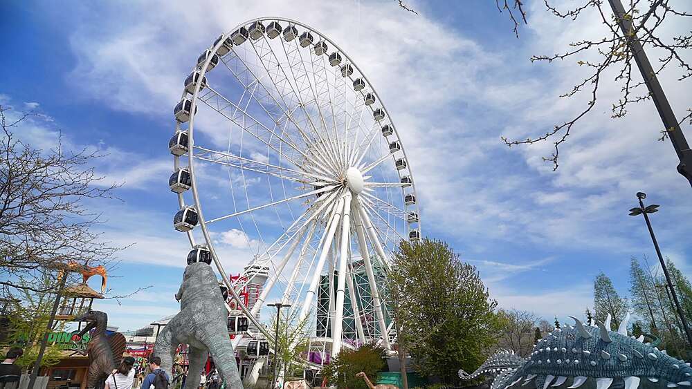 View of ferris wheel and Clifton Hill attractions on a sunny day, Niagara Falls, Ontario, Canada, North America