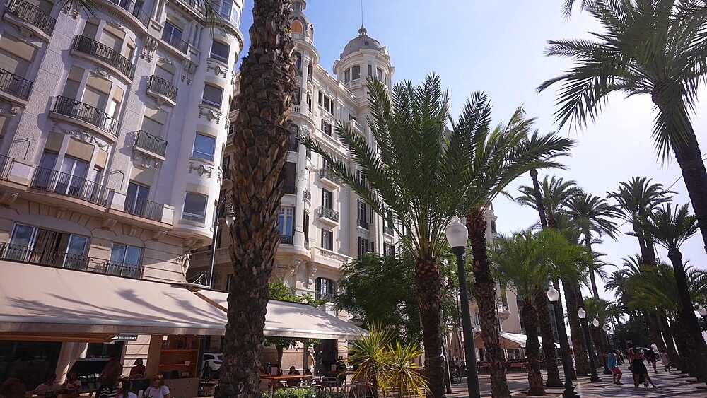 View of cafes restaurants and palm trees on Explanada of Spain on a sunny day, Alicante, Costa Blanca, Spain, Europe