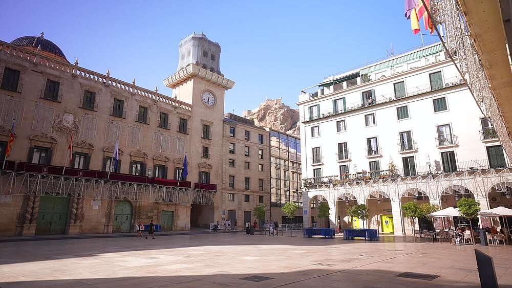 View of Alacant Town Hall Square and Castillo de Santa Barbara in background on a sunny day in Alicante, Alicante, Costa Blanca, Spain, Europe