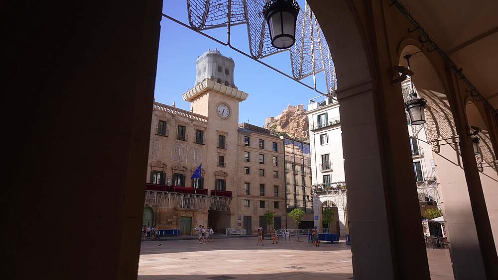 View of Alacant Town Hall Square and Castillo de Santa Barbara in background on a sunny day in Alicante, Alicante, Costa Blanca, Spain, Europe