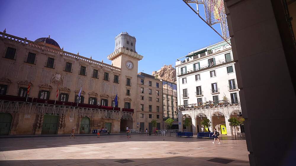 View of Alacant Town Hall Square and Castillo de Santa Barbara in background on a sunny day in Alicante, Alicante, Costa Blanca, Spain, Europe