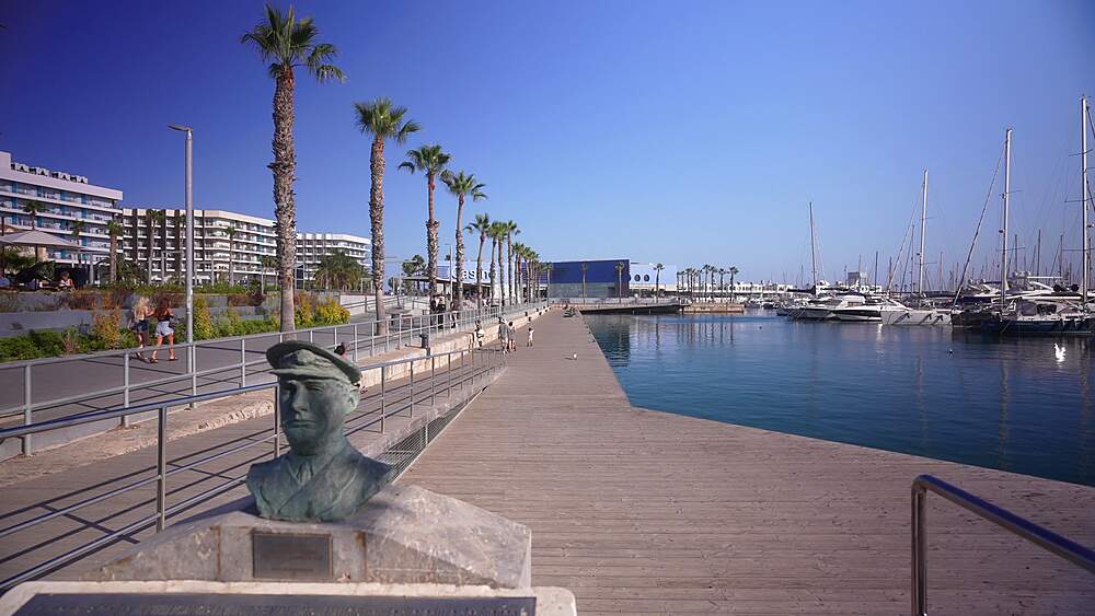 View of boats in Alicante Marina and Casino in background on a sunny day in Alicante, Alicante, Costa Blanca, Spain, Europe