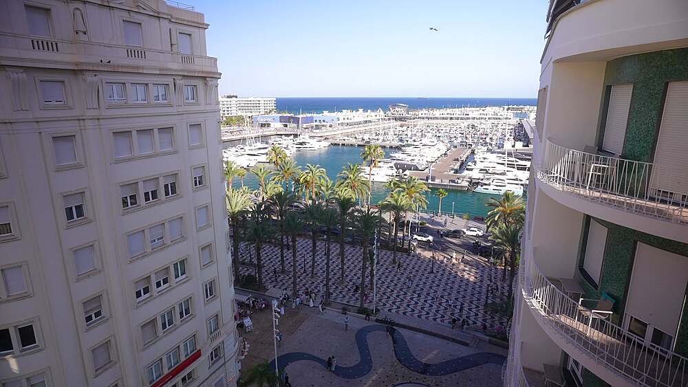 Elevated view of Explanada of Spain with Alicante Marina in background during golden hour on a sunny day, Alicante, Costa Blanca, Spain, Europe