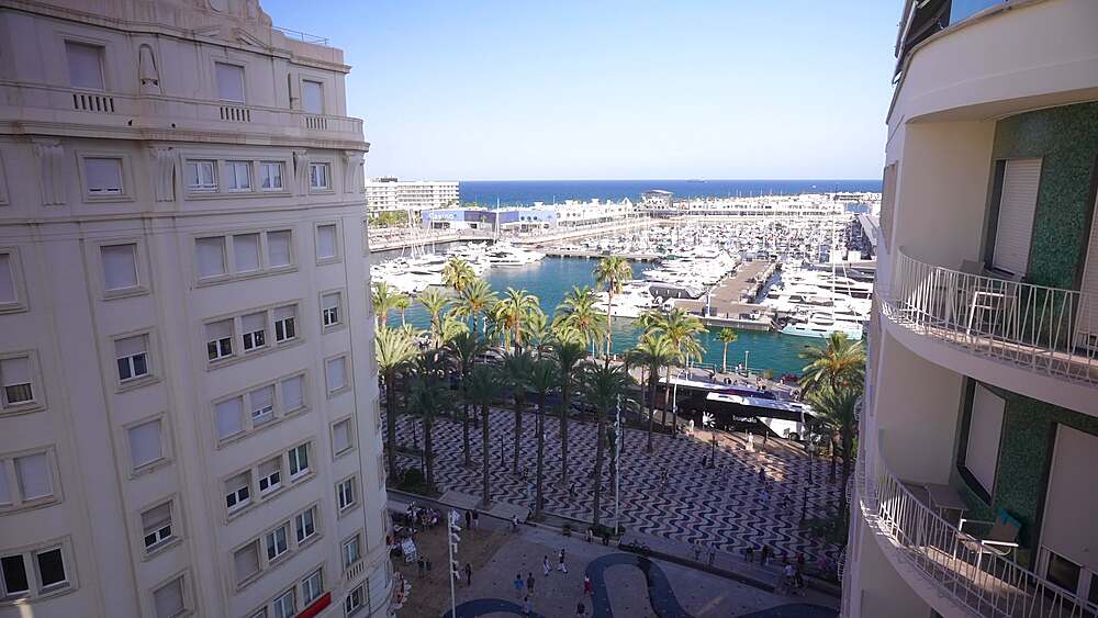 Elevated view of Explanada of Spain with Alicante Marina in background during golden hour on a sunny day, Alicante, Costa Blanca, Spain, Europe