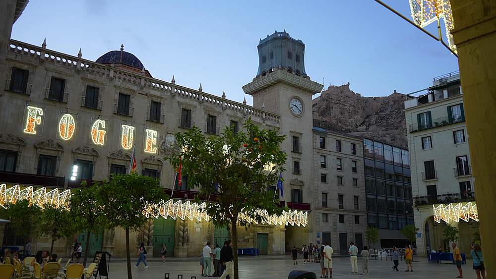 View of Alacant Town Hall Square and Castillo de Santa Barbara in background at dusk in Alicante, Alicante, Costa Blanca, Spain, Europe
