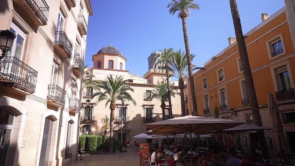 View of restaurants in Placa de la Santissima Fac on a sunny day in Alicante, Alicante, Costa Blanca, Spain, Europe