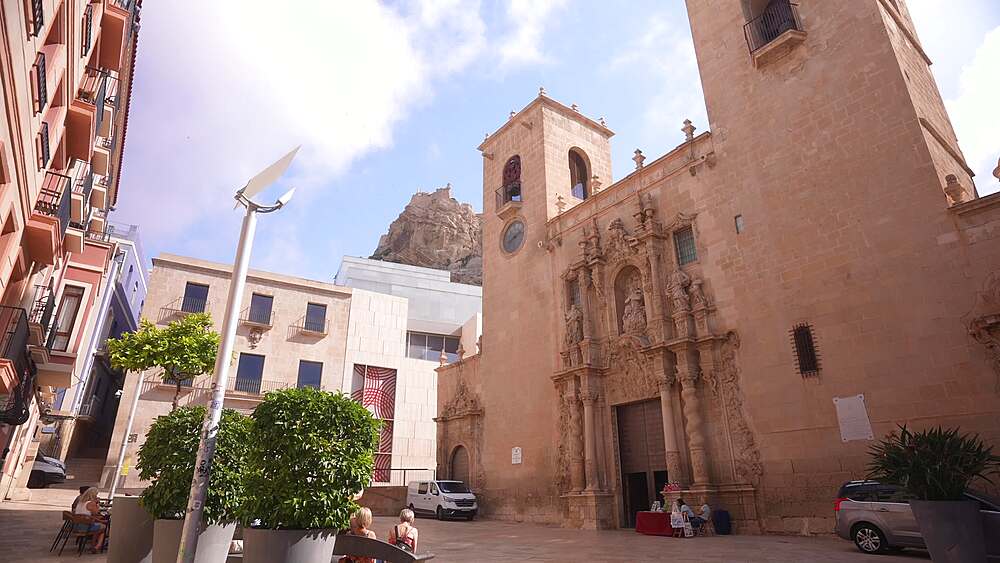 View of Basilica of St Mary of Alicante and Castillo de Santa Barbara in background on a sunny day, Alicante, Costa Blanca, Spain, Europe