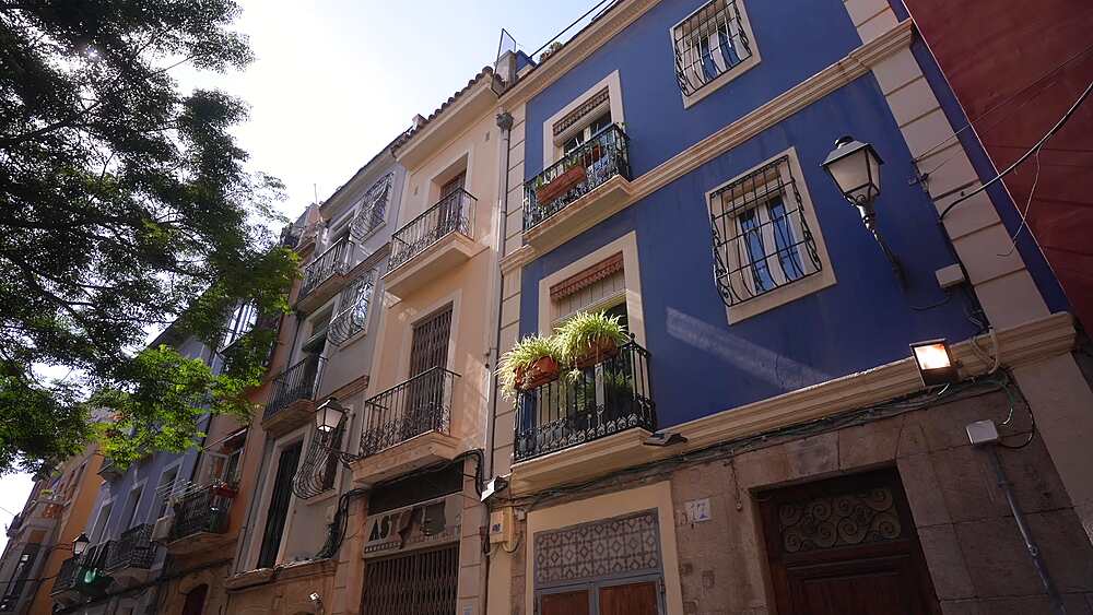 View of Spanish architecture in narrow street in the old town on a sunny day, Alicante, Costa Blanca, Spain, Europe