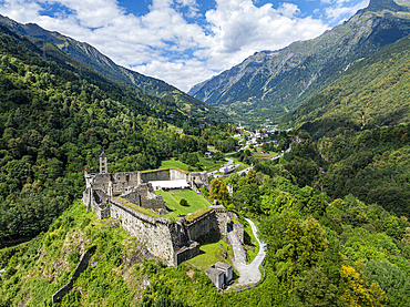 View from above Mesocco castle in Tessino Switzerland showing green valleys and surrounding mountains