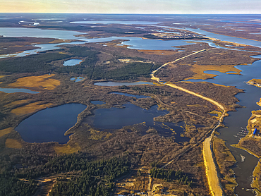 View of the Arctic landscape near Naryan-Mar revealing rivers, lakes, and forests in Nenets Autonomous Okrug, Russia during daylight