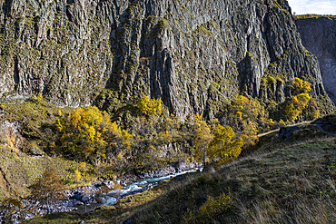Beautiful autumn colors and rocky cliffs in a valley near Mount Elbrus in Kabardino-Balkaria, Russia
