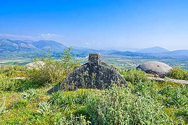 Bunker system sits on a hillside overlooking fields and mountains in Albania near the Greek border