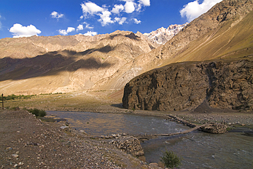 Exploring the rugged terrain and river of Bartang Valley in Pamir region of Tajikistan during a sunny day