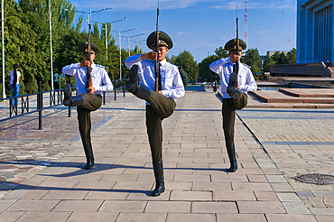 Soldiers perform a ceremonial drill at Ala-Too Square in Bishkek, showcasing discipline and precision during a military event in Kyrgyzstan