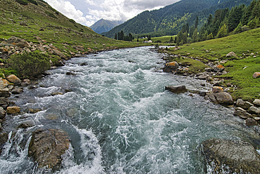 Strong current in river near Jeti ghz as it flows through Karkakol landscape in Kyrgyzstan