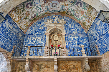 Tiled entrance with blue and white designs in a historic town in Portugal showcasing rich culture and history<br />1184-19265 Tiled entrance with blue and white designs in a historic town in Portugal showcasing rich culture and history