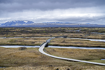 Exploring landscapes at Thingvellir National Park with wooden paths and scenic views in Iceland