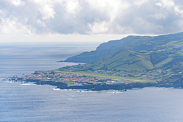 View of the coastline and greenery of Santa Cruz das Flores in the Azores islands of Portugal from above
