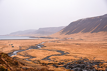 H&oacute;lmkels&aacute; river winding through flat autumn moorland toward the coast, Sn&aelig;fellsnes Peninsula, West Iceland