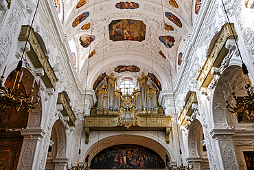 Vienna, Austria &ndash; View towards the choir loft of the Basilica Mary Rotunda, featuring the historic gilded organ and the elaborate Baroque ceiling frescoes of the Dominican Church in Vienna.