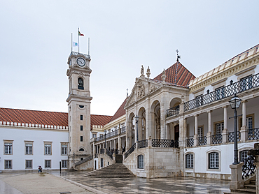 Coimbra, Portugal &ndash; View of the Courtyard of the Schools toward the classic arches of the Via Latina portico and clock tower at the University of Coimbra, founded in 1290 as the country's oldest.