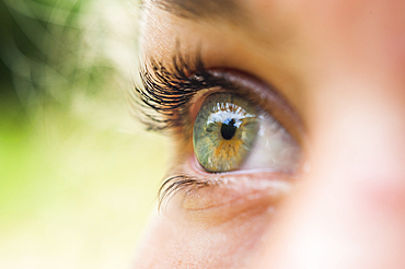 Close-up of the right eye of a teenager, France