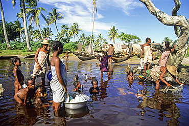 Dishes, laundry, and family games by the Pangalanes Canal,Madagascar,Indian Ocean,Southeast Africa