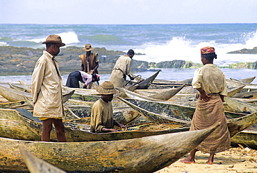 Pirogues and fishermen on a beach of Manakara, Madagascar,Indian Ocean, Southeast Africa
