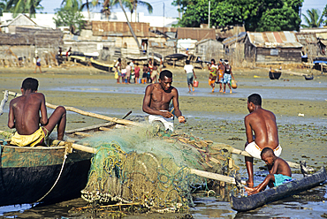 Fishermen mending fishing net on a beach of Tulear, Southern Madagascar, Indian Ocean, Southeast Africa