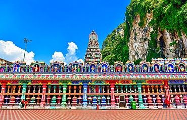 Vibrant entrance of Hindu temple in Batu Caves surrounded by steep limestone hills in Selangor Malaysia<br />1390-1291 Vibrant entrance of Hindu temple in Batu Caves surrounded by steep limestone hills in Selangor Malaysia