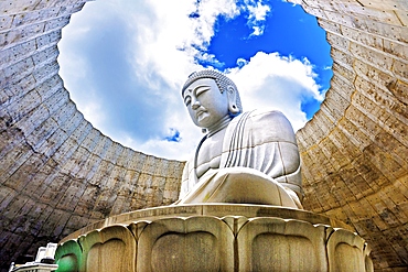 Majestic sculpture of Buddha at Hill of the Buddha (Atama Daibutsu), Sapporo, Hokkaido, Japan. This Buddhist shrine is a stunning piece of contemporary art located within the Makomanai Takino Cemetery.