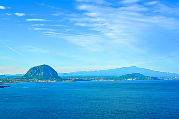 View of Sanbangsan from Songak Mountain offers a scenic landscape on Jeju Island during a clear day