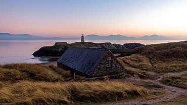 Cottage near Tr Mawr Lighthouse with coastal views at dusk in Wales