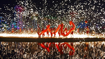 Dragon dance performance with fireworks lights up the night in Wuhan, China during festive celebration